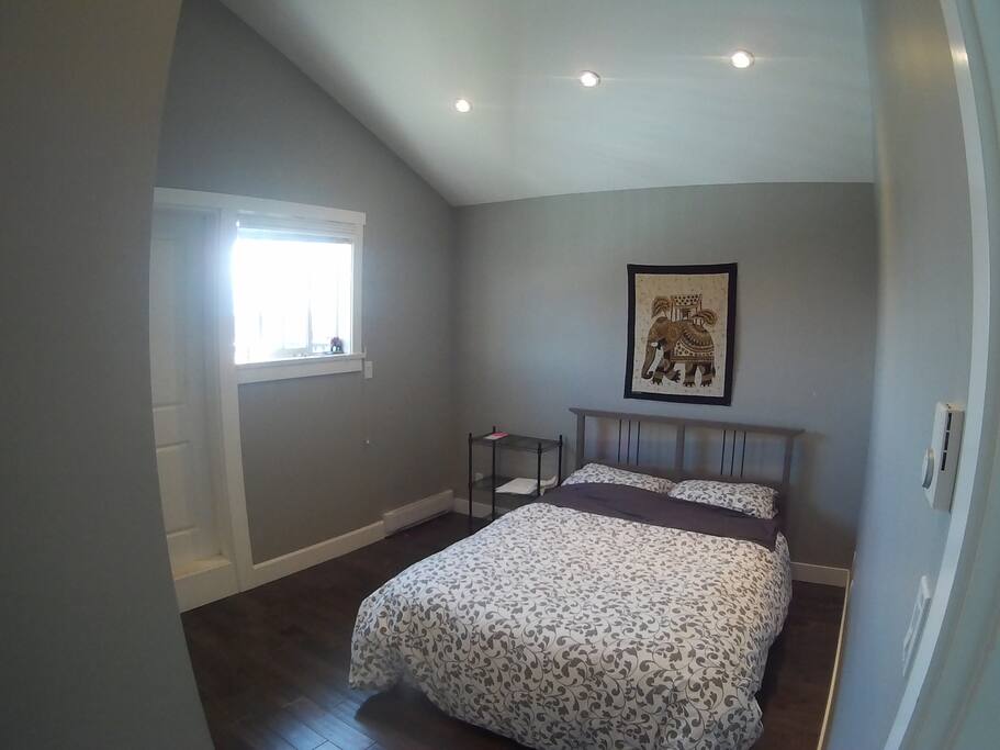Your Queen size Bed and Room. HIGH Ceilings, spacious and cozy.
