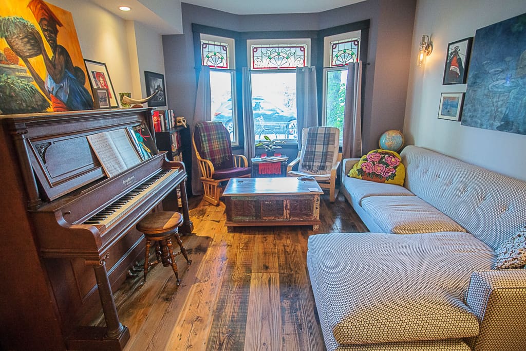 Original stained glass windows let through the perfect light for musicians to play the piano by!