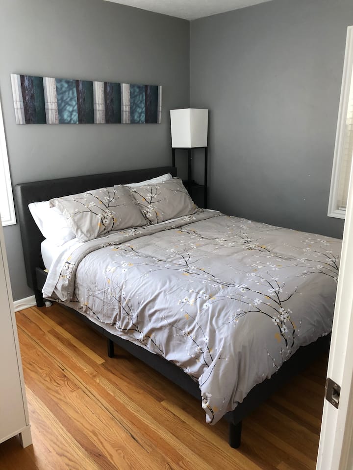 Upstairs bedroom with queen bed.