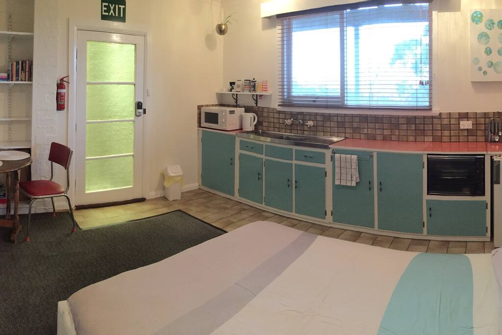 Self-contained kitchen with fridge, two bit plates, oven, microwave etc