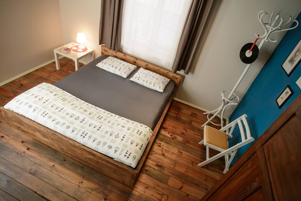 Handmade wooden bed in the Superior Double Room