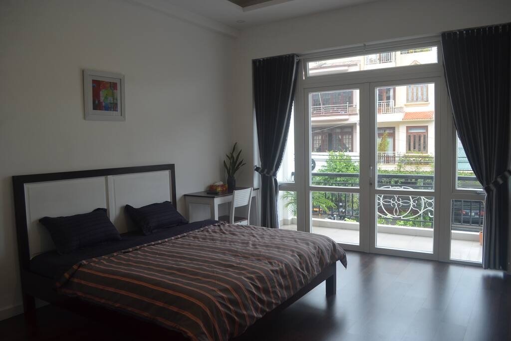 Bedroom 1: first floor, queen bed, clean linens, balcony and en suite bathroom