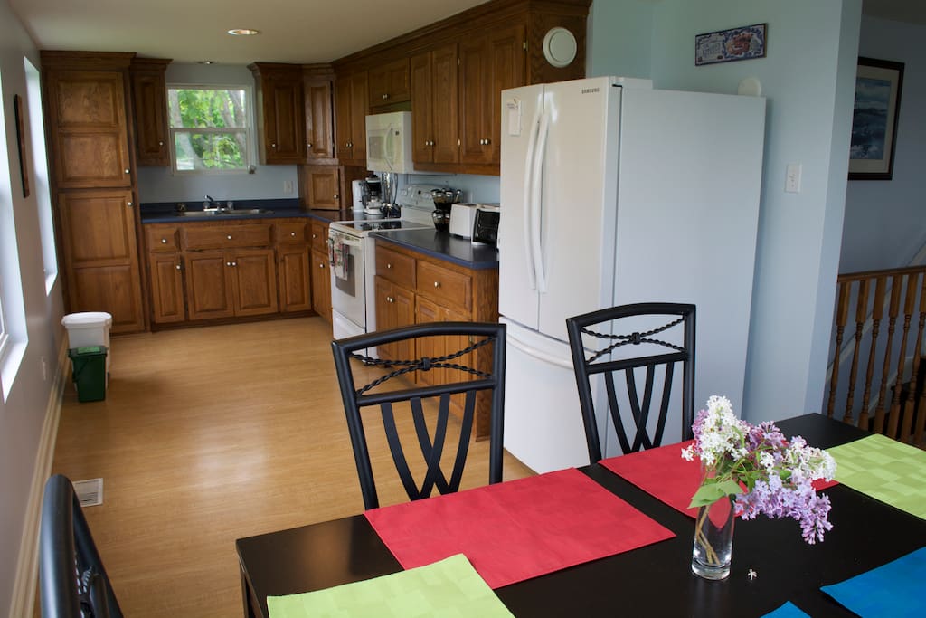 Well equipped kitchen with eat in dining area and views of the water