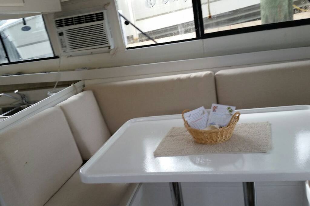 One of the two couch/benches and card or dining table