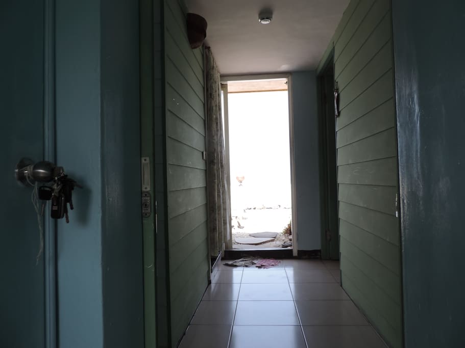 from private entrance you could see the hallway leads to ocean view balcony and bedroom in right side bathroom in left.