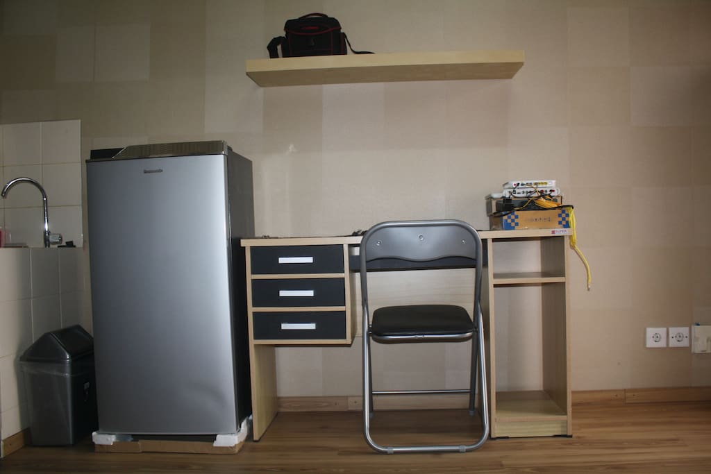 Refrigerator, table, and chair