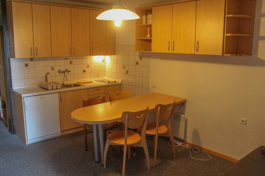 Living room with kitchen with dining room