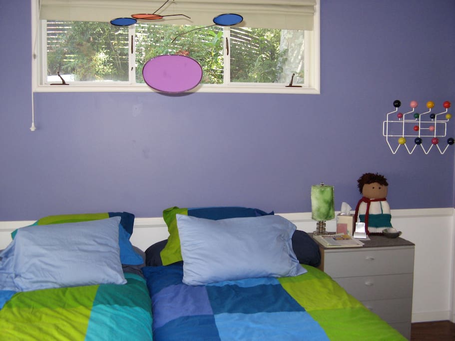 Guest bedroom with dual twin, adjustable beds (en suite bath not pictured)