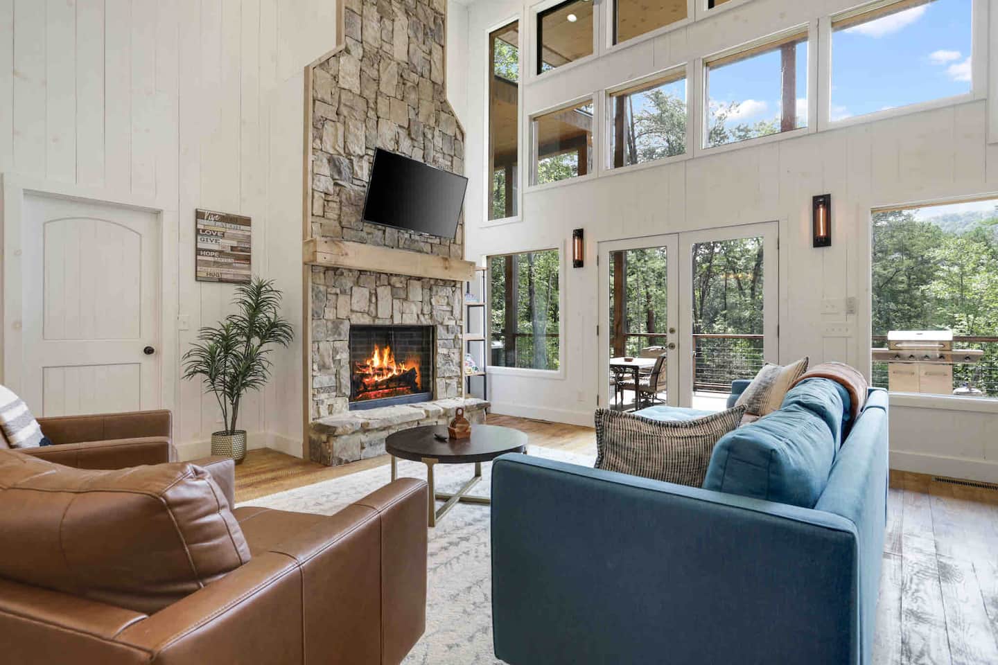 Open-concept living room with high ceilings and unobstructed views throughout the main level