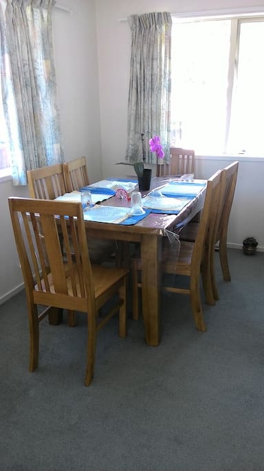 sunny dinning room with comfortable chairs