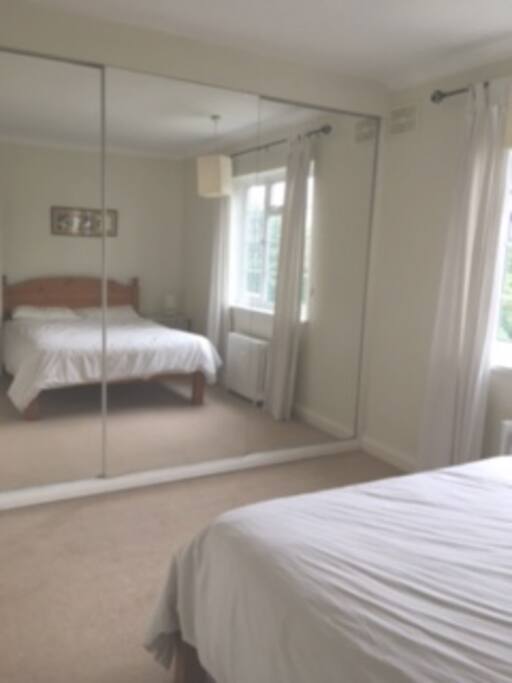 Lots of wardrobe space behind the mirror doors