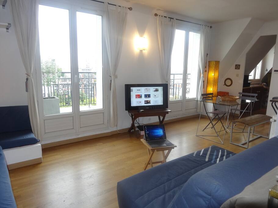 Living-room with view on terraces