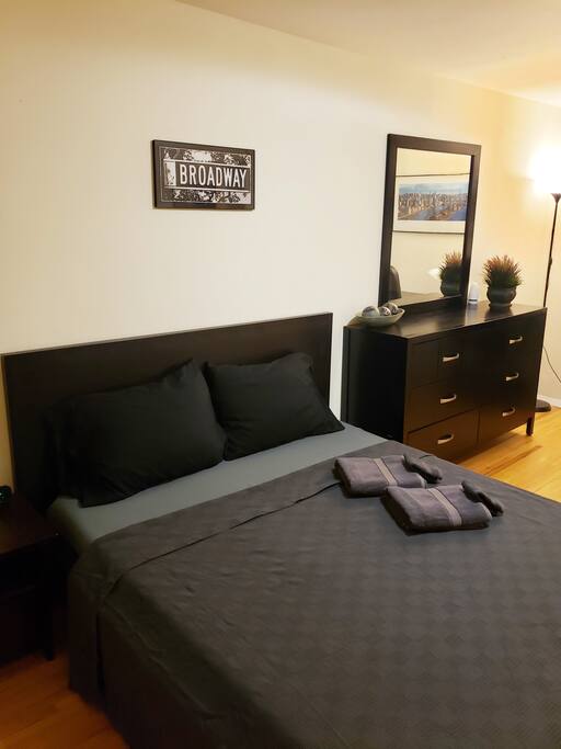Queen bed and vanity.
