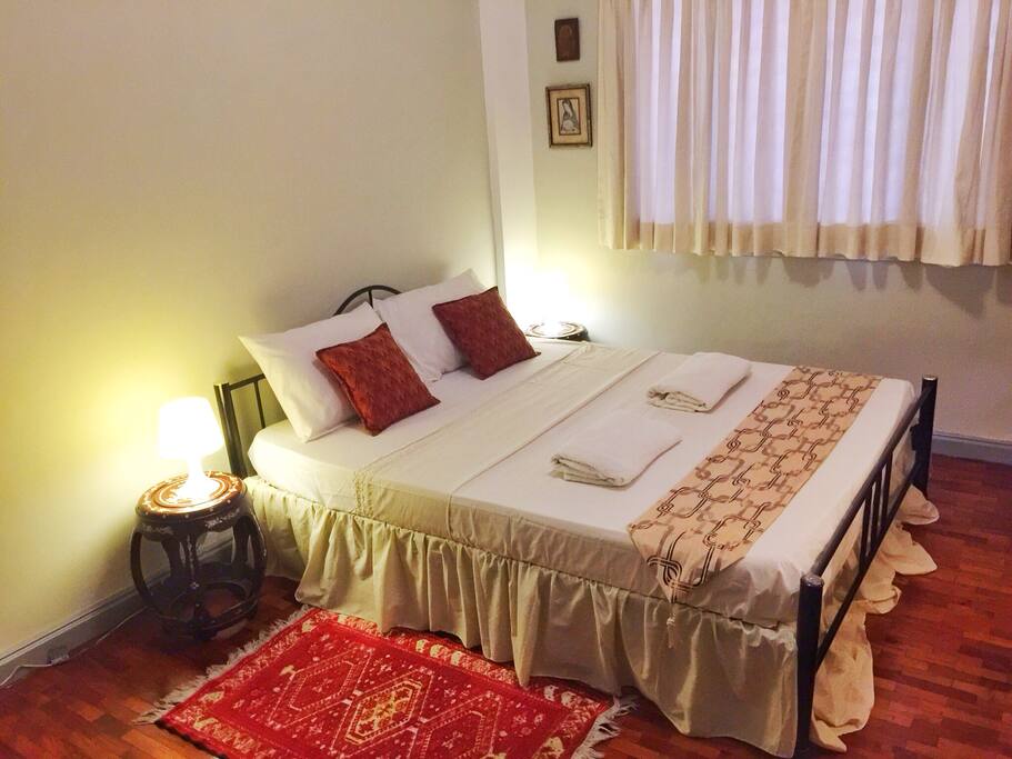 Private bedroom with queen-size bed.