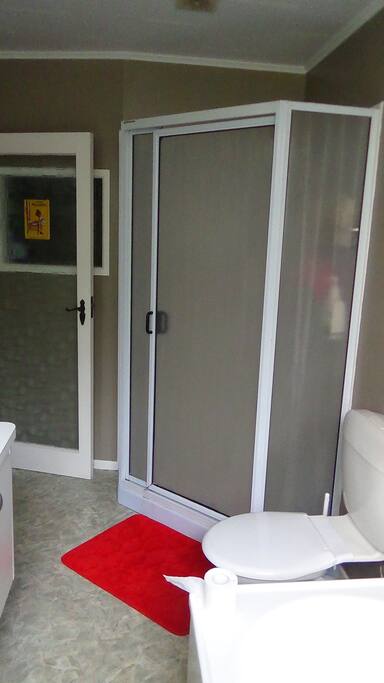 bathroom with shower and bath and 2 sinks.