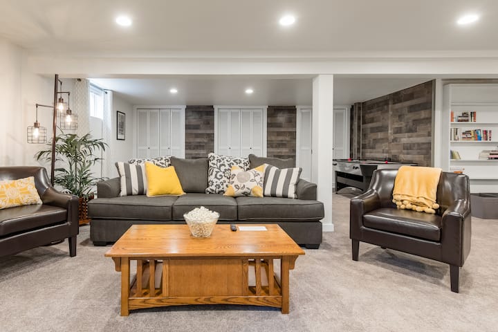 The spacious basement/bonus room is the ideal space for family movie and game nights; the sofa becomes a queen sized bed to create a 5th "bedroom".