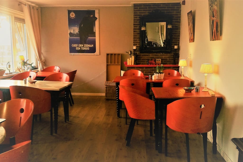 This is the living. Here we serve breakfast (between 8.00-10.00). Also we have free coffee & tea and a fully stocked fridge in case you would like a beverage. Would you prefer to eat in your room or on the terrace ... no problem!
