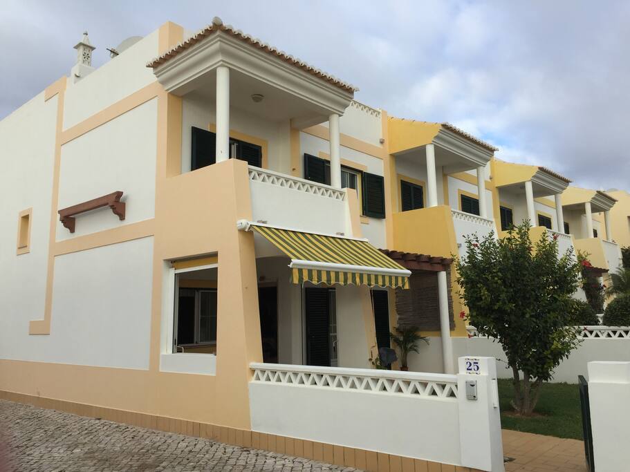 The house is at the end of the terrace, on the sea side.