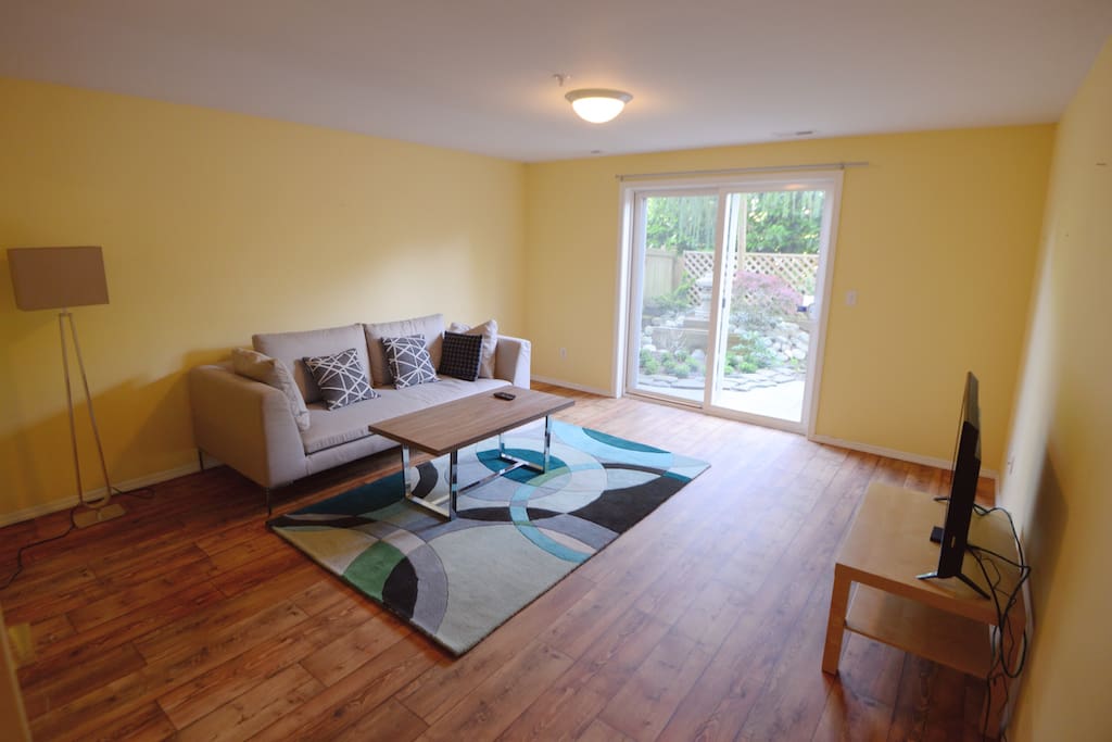 Living room with TV and access to the patio