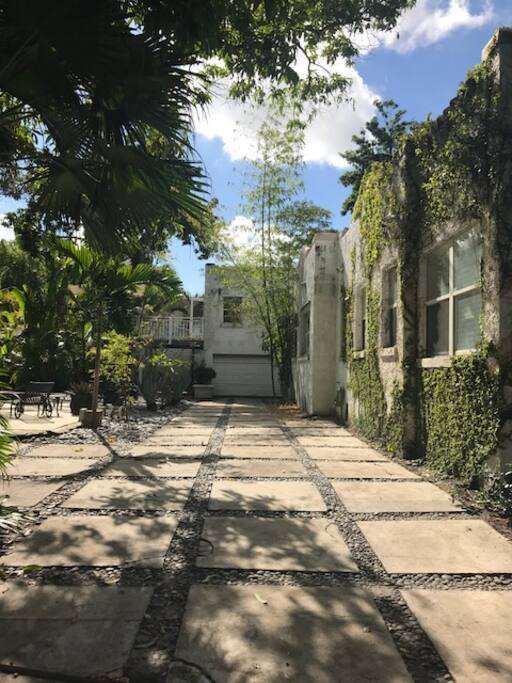 Side of house looking down private drive.