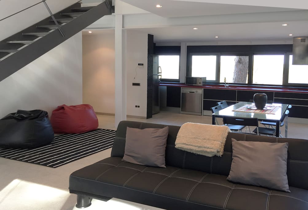 Lounge, Dining room and kitchen by private terrace with pool. 2 sofa-beds (large twin). Bathroom with shower.
