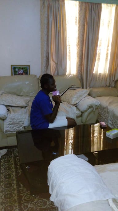 Daughter Parvin in the living room watching television