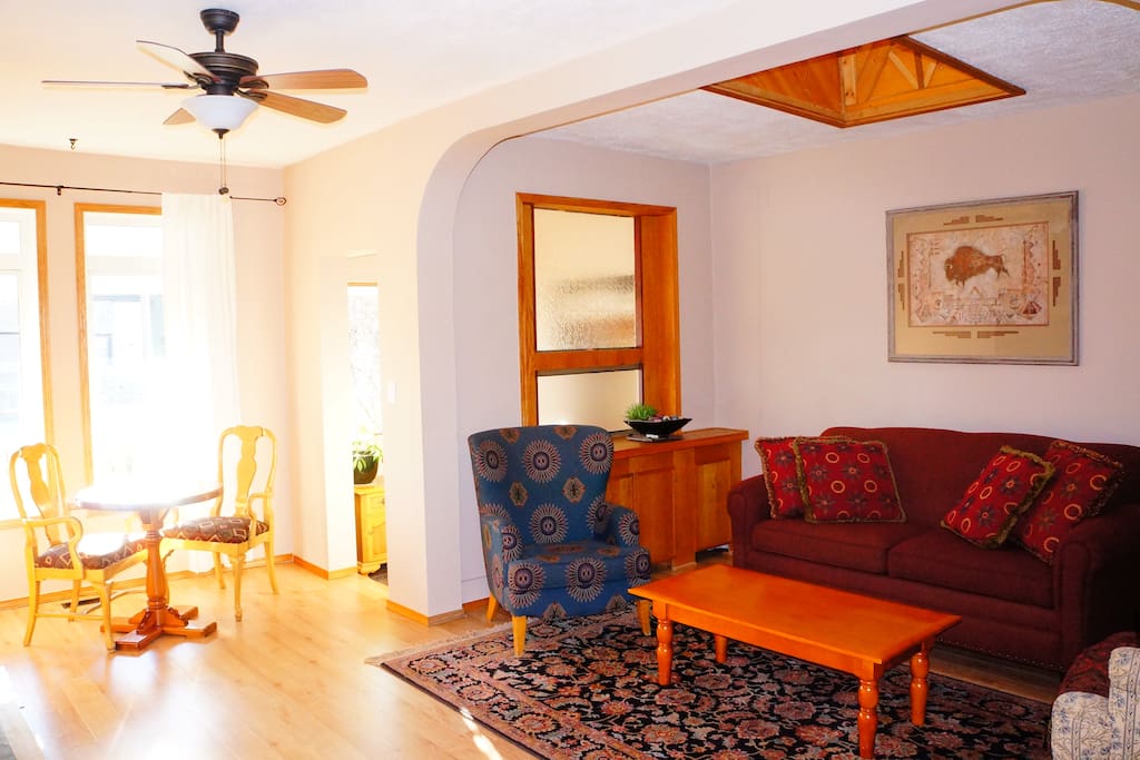 Spacious living room with fireplace. Sunroof and big windows for natural light with a sofa bed (double).