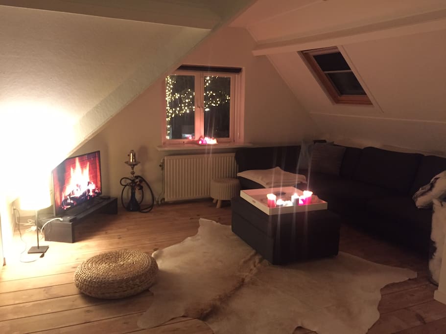 A nice sized living room with a lot of windows