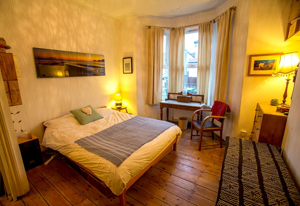 Lovely double bedroom with a Victorian bay window and original floorboards