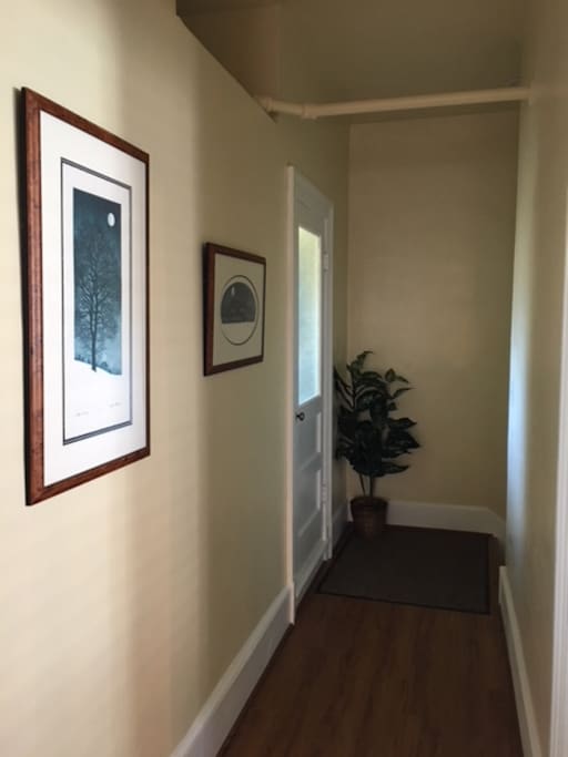 Hall at the top of the stairs - the laundry room is behind the door.