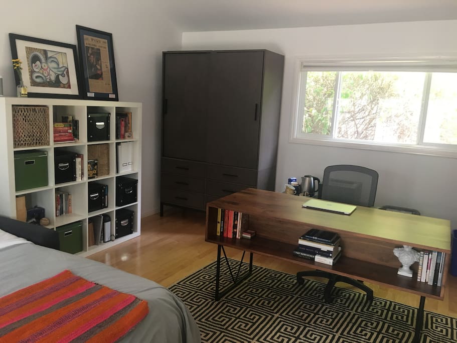 Desk for use and many books to read. The Armoire can be emptied partially for use, just let us know beforehand