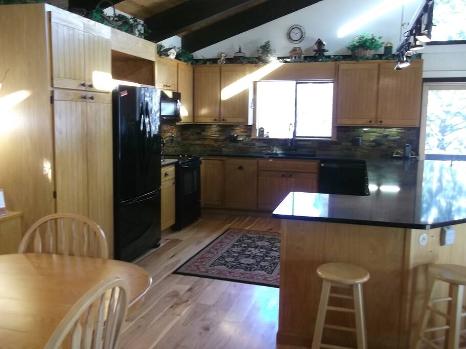 Kitchen with new quartz counters and back splash