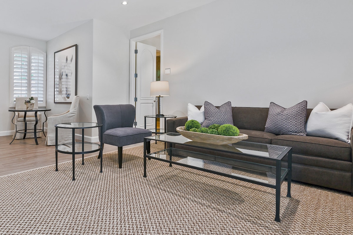 Casita living room with a pull out couch and mini kitchenette.