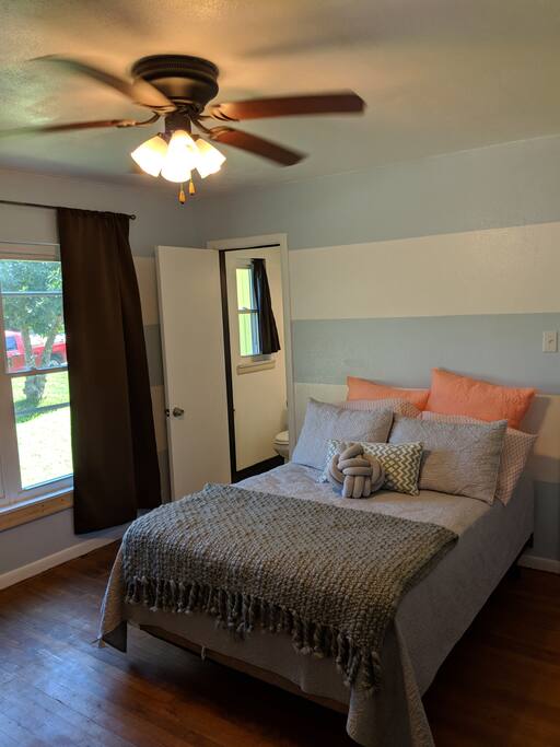 Bed with a view of the bathroom