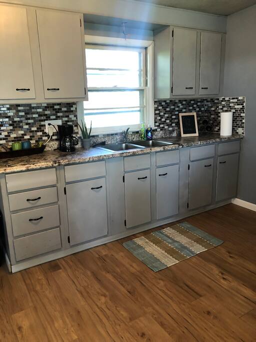 The kitchen area. We provide silverware, plates, toaster oven and coffee!