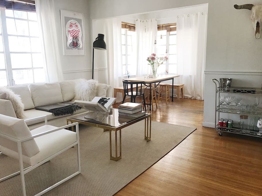 Living room and dining room both share a lot of light.