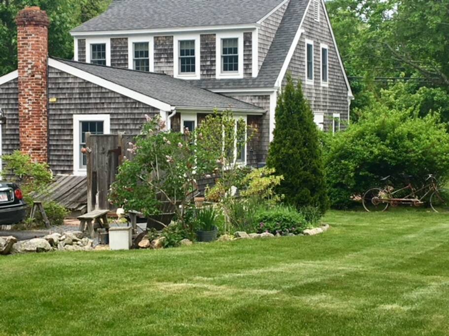 Partial viewof side yard & rear of house.