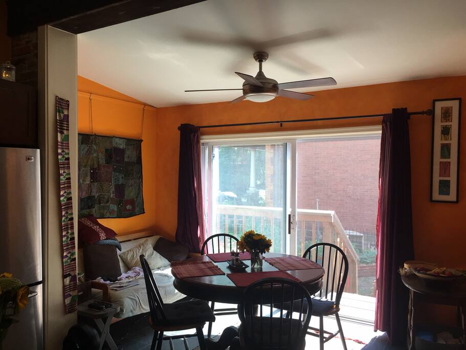 Kitchen eating area with doors that open to back garden