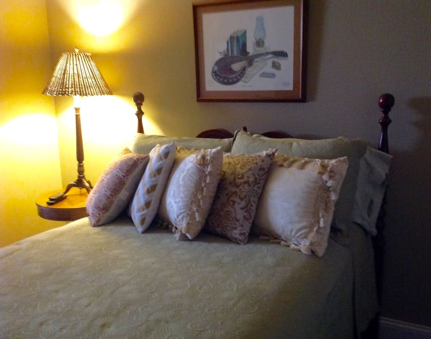 Comfortable bed with furnishings.