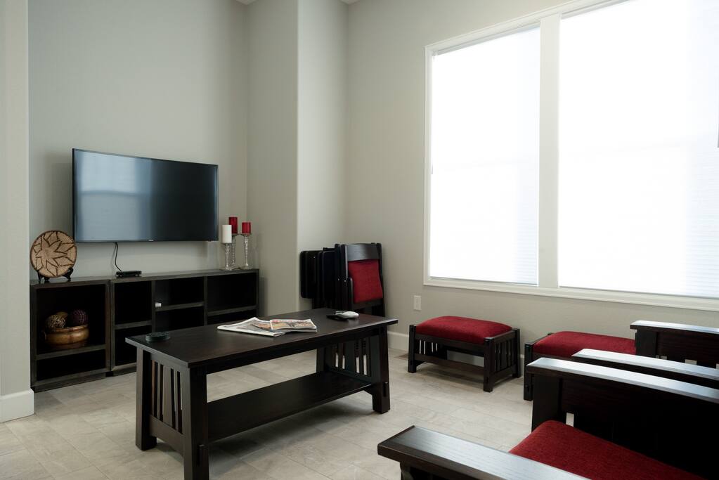 Plenty of natural light and a big screen television.