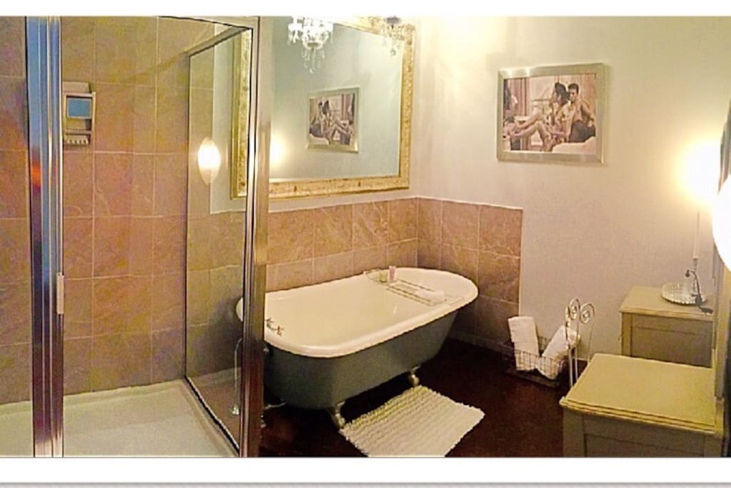 Relax and recharge in this gorgeous bathroom with antique claw foot tub