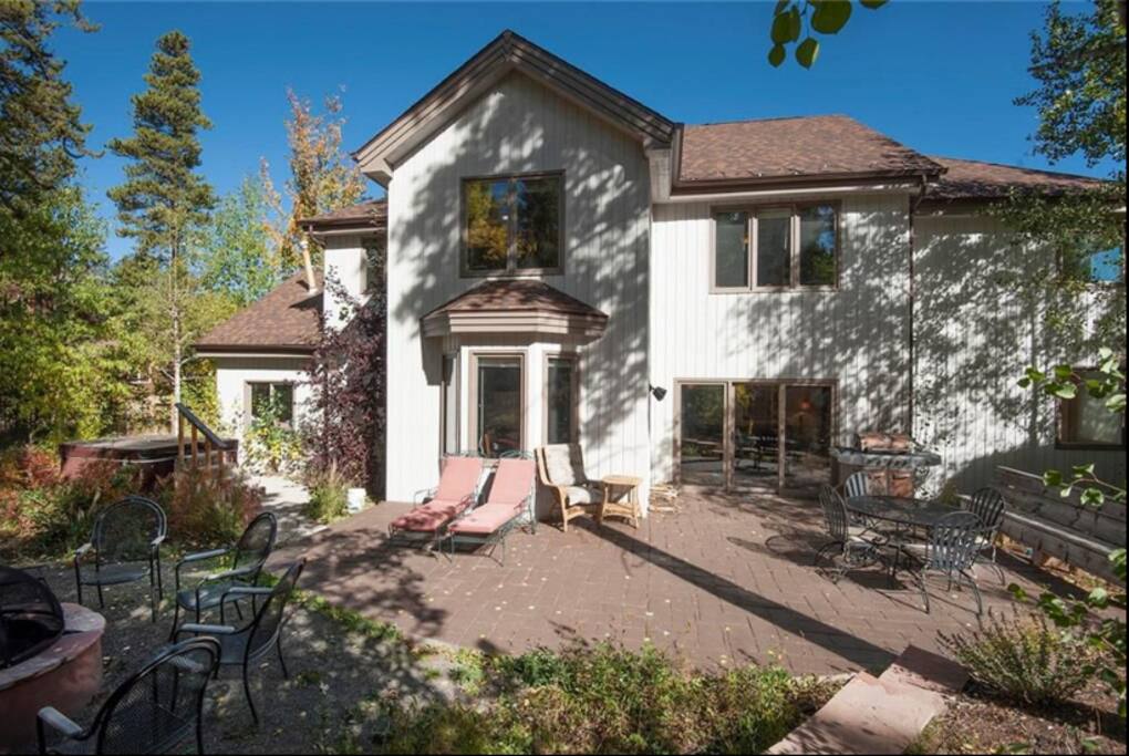 Your backyard patio with a firepit and hot tub!