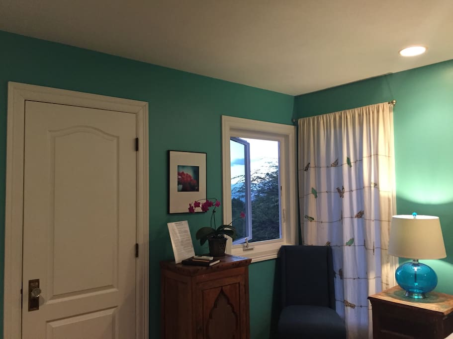 Another view of the bedroom/door to the bathroom.