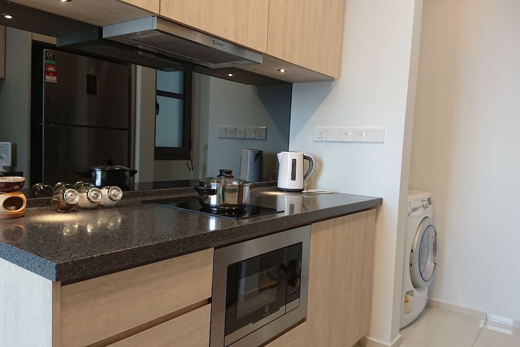 Full kitchen facilities (Cooking Hob + Hood, Microwave Oven, Kettle, Refrigerator, Washing Machine + Dryer in One)