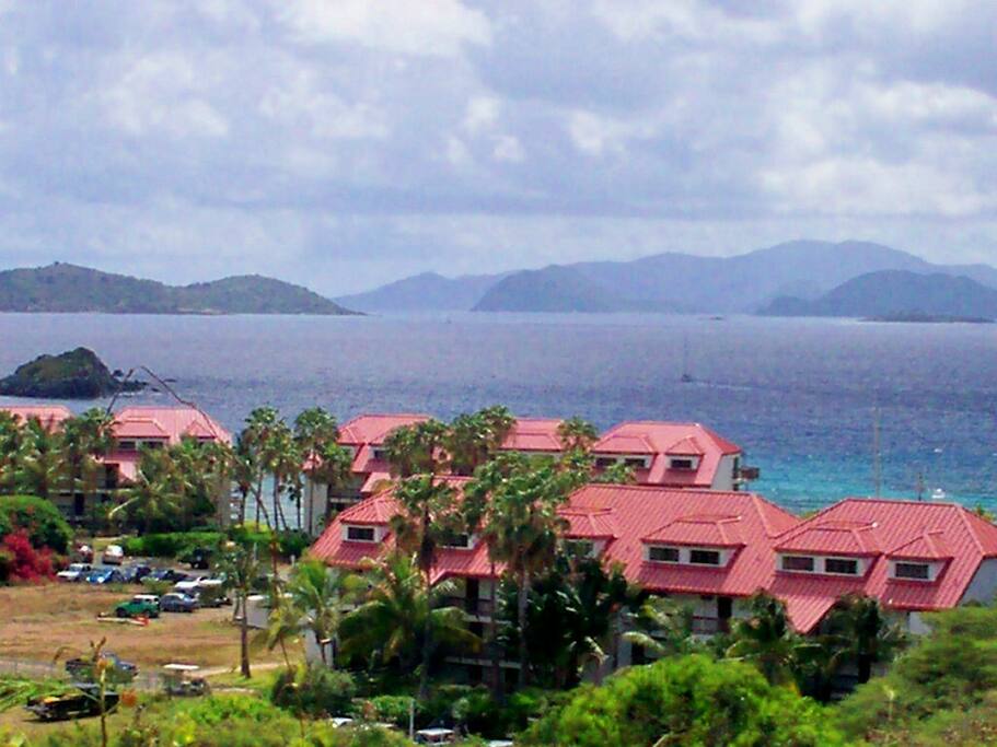 View at the entrance to the condo complex. The condo is on the ground floor of the far building in the middle.