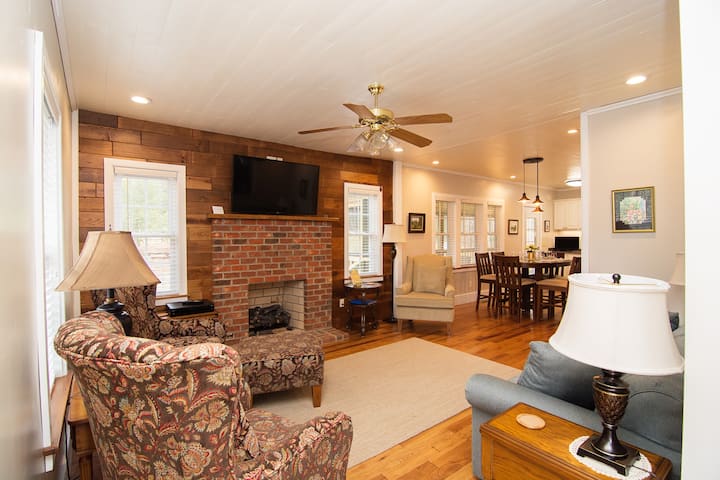 Living area with gas logs, large screen HDTV, comfy seating for 6, open floor plan