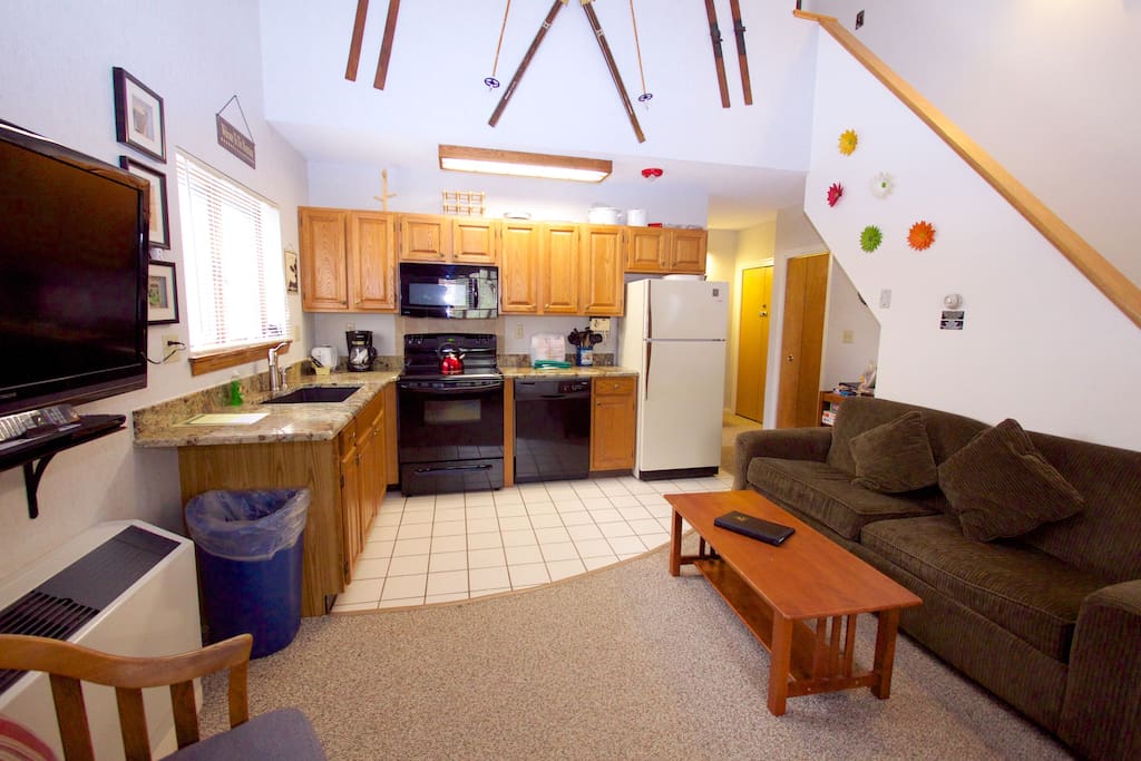 Kitchen & living area with pull out queen sofa bed