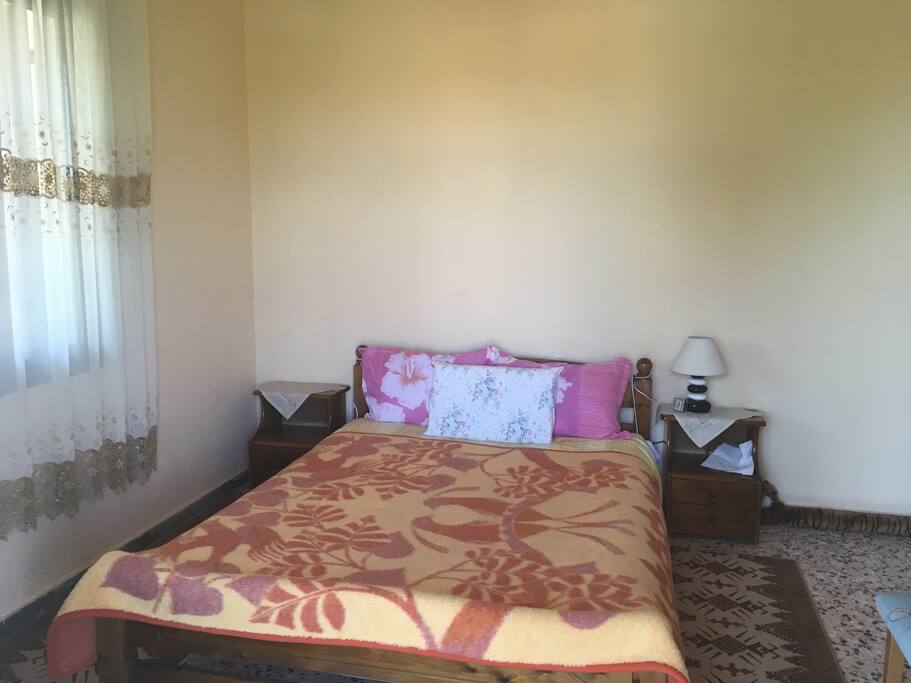 Double bedroom with doors onto balcony