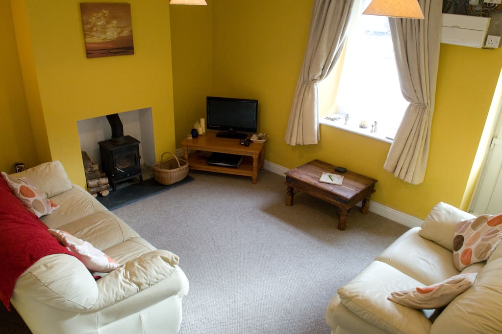 Lounge with wood burning stove.