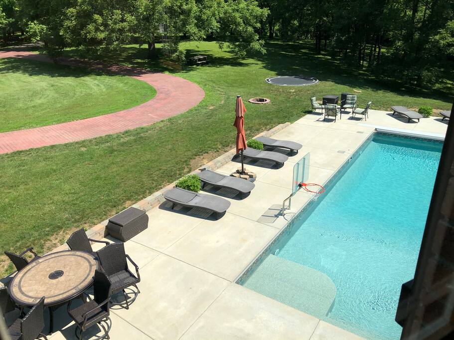 Pool, fire pit and trampoline from upstairs bedroom